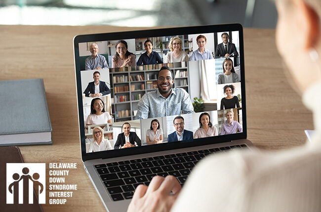 DSIG Virtual Conferences - Image of people video conferencing on a laptop - someone looking at a computer monitor with a group of people on it.