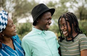 An image of three people smiling
